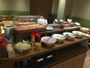 a buffet with different types of food on a table at Hotel Crown Hills Onahama in Iwaki