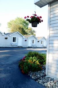 a flower pot hanging from the side of a house at adoba® Lockview in Sault Ste. Marie