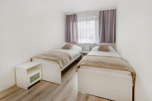 Krevet ili kreveti u jedinici u okviru objekta Apartament Poniatowskiego - Komfortowe Noclegi