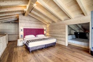 Gulta vai gultas numurā naktsmītnē Dolomiti Lodge Alverà