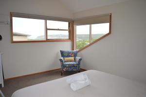 Tempat tidur dalam kamar di Apostle Hideaway - Central Port Campbell