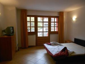 A bed or beds in a room at Residence Le Orchidee