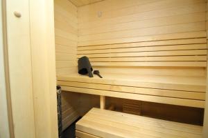 a sauna with a black object sitting on a shelf at Tallinn City Apartments Old Town Suites in Tallinn