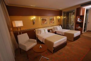 A bed or beds in a room at Holiday Inn Ankara-Kavaklidere, an IHG Hotel