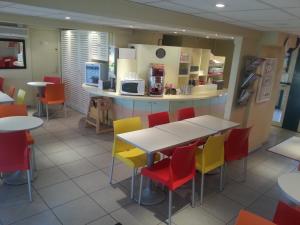 A kitchen or kitchenette at Premiere Classe Lyon Est Aeroport Saint Exupery