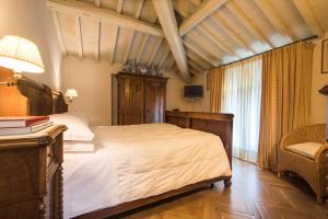 Una cama o camas en una habitación de Villa Le Magnolie