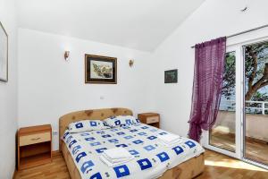 A bed or beds in a room at Villa Vranic Apartments