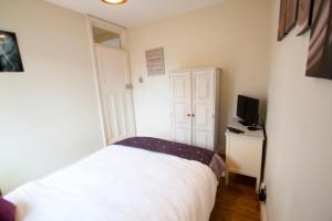 Ein Bett oder Betten in einem Zimmer der Unterkunft Richmond Modern Apartment