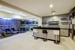 A kitchen or kitchenette at Hotel Neo Palma Palangkaraya by ASTON