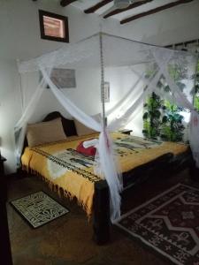 Voodi või voodid majutusasutuse Villa Fortuna Malindi toas