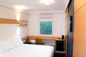 Giường trong phòng chung tại ibis Budget - Gosford