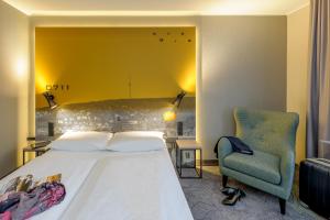 Cama ou camas em um quarto em Mercure Stuttgart Zuffenhausen