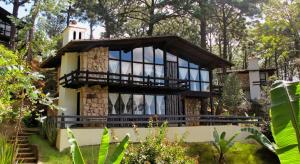 a house in the middle of a forest at Monteverde in Mazamitla