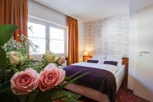 Rhein Neckar Hotel tesisinde bir odada yatak veya yataklar