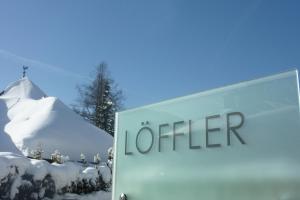 a sign for the office is covered in snow at Der Löffler am Semmering Bed&Breakfast in Semmering