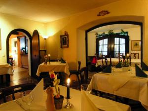 a dining room with two tables and a mirror at Haus Wartenberg in Salzburg