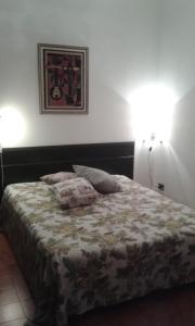 Cama ou camas em um quarto em Casa Mimmi