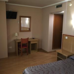 Ліжко або ліжка в номері Hotel Avenida Leganés