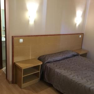 Ліжко або ліжка в номері Hotel Avenida Leganés