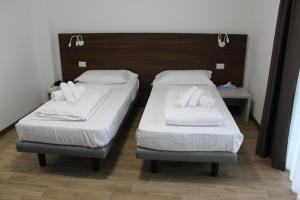 Cama ou camas em um quarto em Hotel Bocciolo