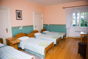 A bed or beds in a room at Sagadi Manor Hostel