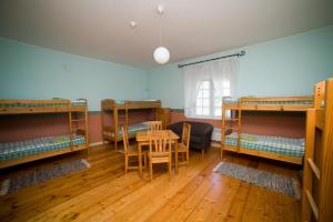 A bed or beds in a room at Sagadi Manor Hostel