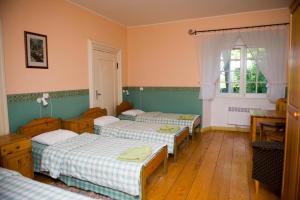 A bed or beds in a room at Sagadi Manor Hostel