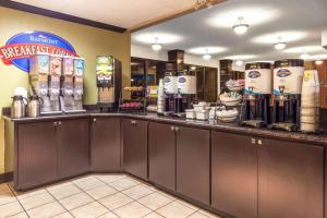 a coffee shop with a counter with machines on it at Baymont by Wyndham Amarillo East in Amarillo