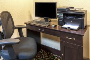 an office with a desk with a computer and a printer at Baymont by Wyndham Amarillo East in Amarillo