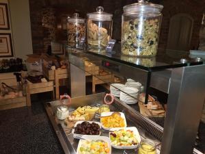 a buffet with many different types of food in jars at Killarney Heights Hotel in Killarney