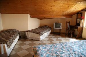 A bed or beds in a room at Popov Guest House