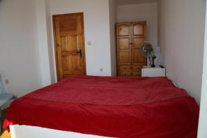 A bed or beds in a room at Popov Guest House