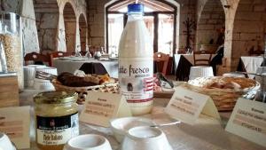 a bottle of water sitting on top of a table at Masseria Torricella in Alberobello