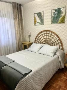 Tempat tidur dalam kamar di Lauramer Apartamento Bakio