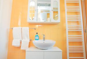 a bathroom with a sink and a mirror and towels at Maksimir-Rebro in Zagreb