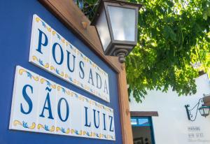 um sinal para um restaurante sao lilo em Pousada Sao Luiz em Porto Seguro