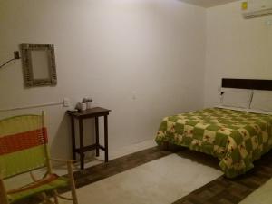 A bed or beds in a room at Hotel Pedregal