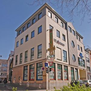 a building on the corner of a street at Hotel Aulmann in Trier