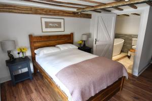 A bed or beds in a room at The Swan Hotel, Alresford