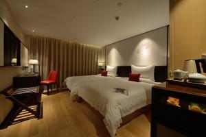 Krevet ili kreveti u jedinici u okviru objekta Guangzhou City Join Hotel Shipai Qiao metro Branch