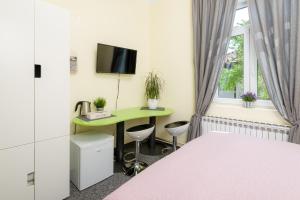 Televizorius ir (arba) pramogų centras apgyvendinimo įstaigoje Anastasia Suites Zagreb