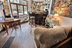 a living room with a couch and a table at Golden Lion in Bouillon