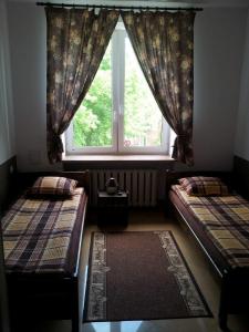 A bed or beds in a room at Hostel Maxim