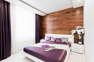 Prestige Plaza Apartments tesisinde bir odada yatak veya yataklar