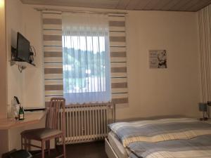 Cama ou camas em um quarto em Pension Haus Wanninger