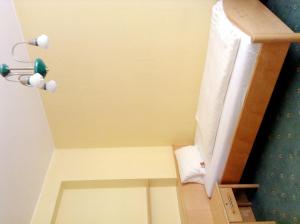 a small bathroom with a toilet in a room at Hotel Garni in Bad Schallerbach