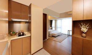 Yuwa Serviced Residence 객실 침대