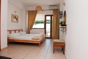 Voodi või voodid majutusasutuse Apartments Villa L&M Skiathos toas