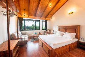 Giường trong phòng chung tại Villa Retreat - Boutique Hotel