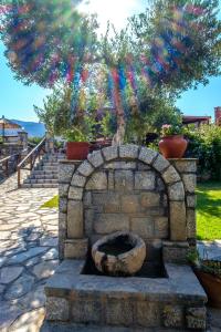 A garden outside Corali Studios & Portobello Apartments